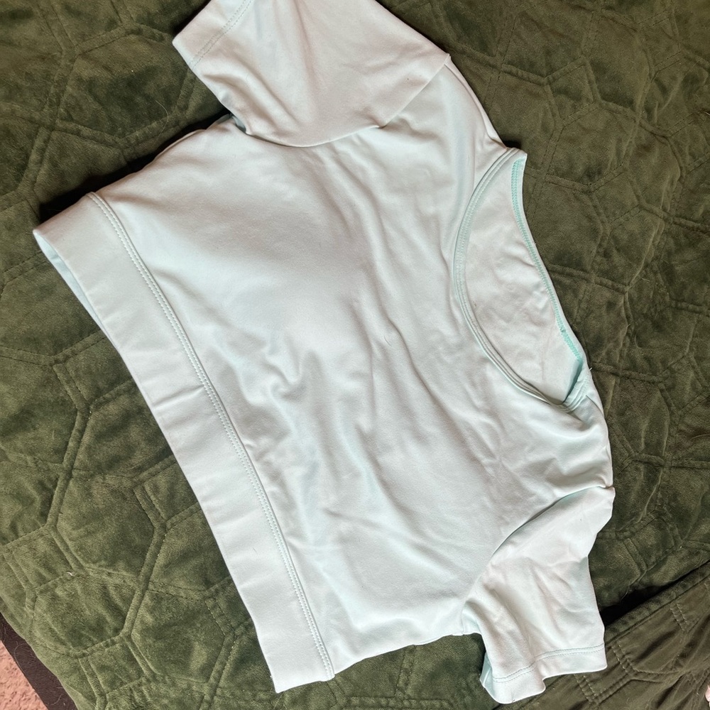 Baby blue open back NVGTN crop size medium.